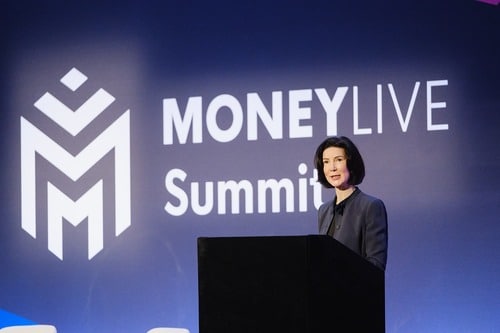 Banking conference speaker on stage