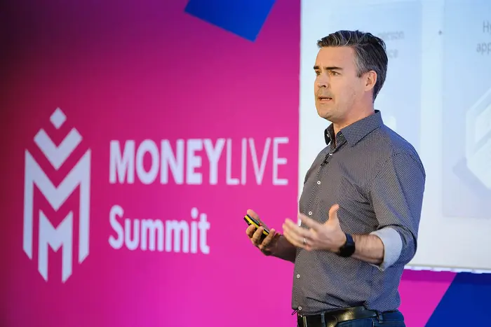 Speaker on stage on MoneyLIVE Summit payments event