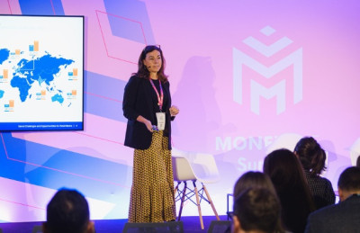 Speaker on stage at banking conference